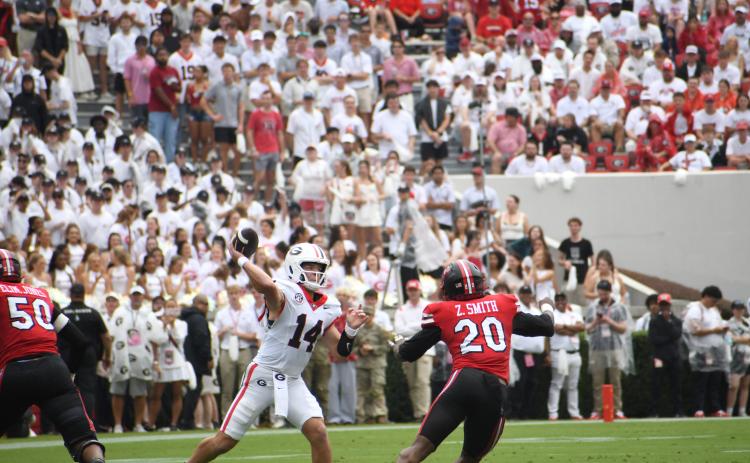 Wesley Branch/The Clayton Tribune. Former Rabun County and current UGA quarterback Gunner Stockton releases a pass downfield during Georgia’s 70-20 win over Western Kentucky on Sept. 12. Stockton tied a school record with five touchdown passes in the contest. The Dawgs will be on the road Saturday against SEC foe Arkansas.