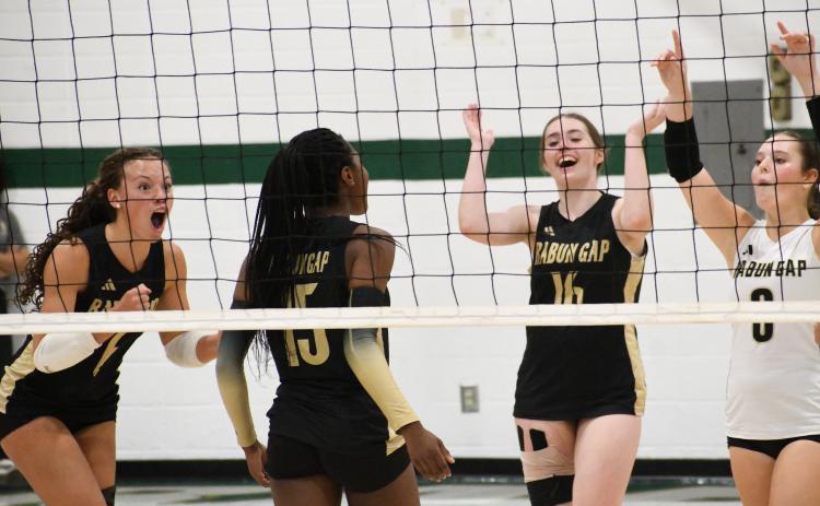 Wesley Branch/The Clayton Tribune. RGNS girls volleyball team celebrates after a point during its 3-1 win versus Swain County on Sept. 28. The RGNS girls improved to 7-11 with the win, and have gone 7-4 in their last 11 matches after an 0-7 start.