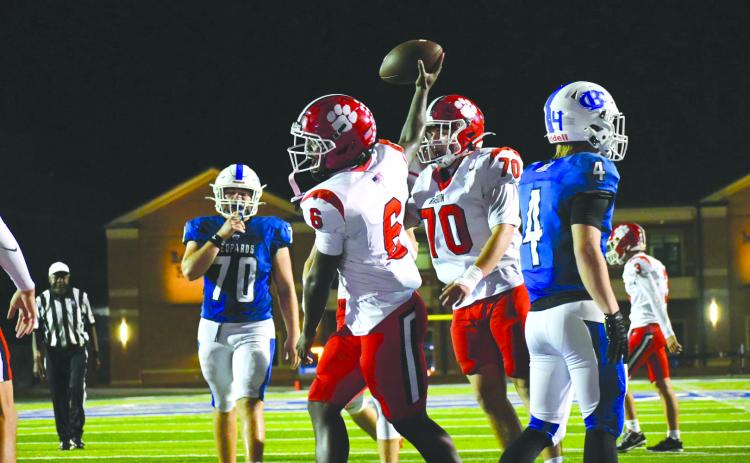Enoch Autry/The Clayton Tribune. Senior JK Fruster celebrates one of his three rushing touchdowns with teammate Ron Baumes (70) on Sept. 25 as the Wildcats defeated Banks County 45-10. The next RCHS game is Oct. 9 at home.