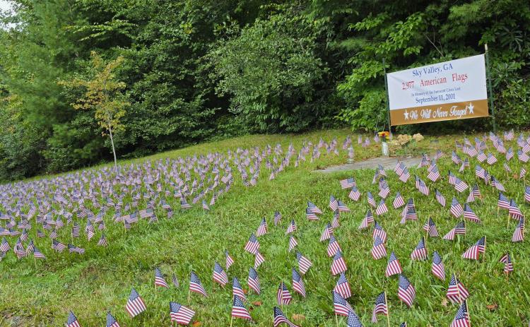 Photo courtesy of Sky Valley Mayor Benita Cotton-Orr. To honor those lives lost during the Sept. 11, 2001, terrorist attacks, volunteers placed  2,977 flags on the lawn at Sky Valley City Hall, commemorating the innocent victims of the terrorist attacks. People locally and nationally will take a moment Friday to reflect back 25 years ago.