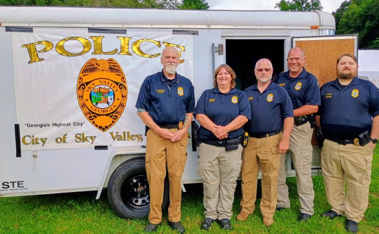Megan Horn/The Clayton Tribune.  The Sky Valley Police Department hosted this year’s National Night Out (NNO) event on Tuesday, Aug. 4. The event built community trust and partnerships. Pictured are members of the Sky Valley Police Department including Chief Ron Baumes, left, Officer Clark, Lt. Edwards, Sgt. Maloney and Officer Golden.