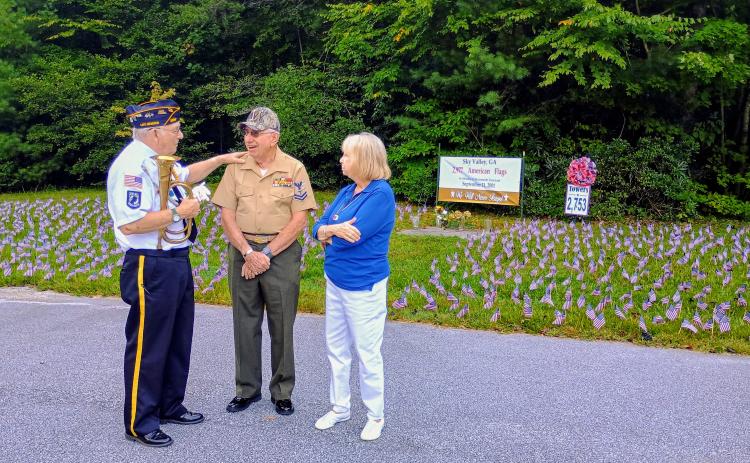 Megan Horn/The Clayton Tribune. Veteran Doug Wayne, Major (Ret.) U.S. Army, left; Bruce Gant, Navy Corpsman, Vietnam Combat veteran and two-time Purple Heart recipient; and Vicky Gant reflect on the lives lost 25 years ago on Sept. 11, 2001. They attended a special event in Sky Valley last Friday to honor the lives lost that terrible day.