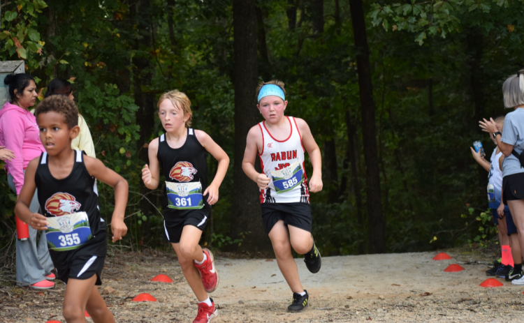 Submitted Photo. Alden English with the Rabun County Recreation Department sprints to the cross country finish line.
