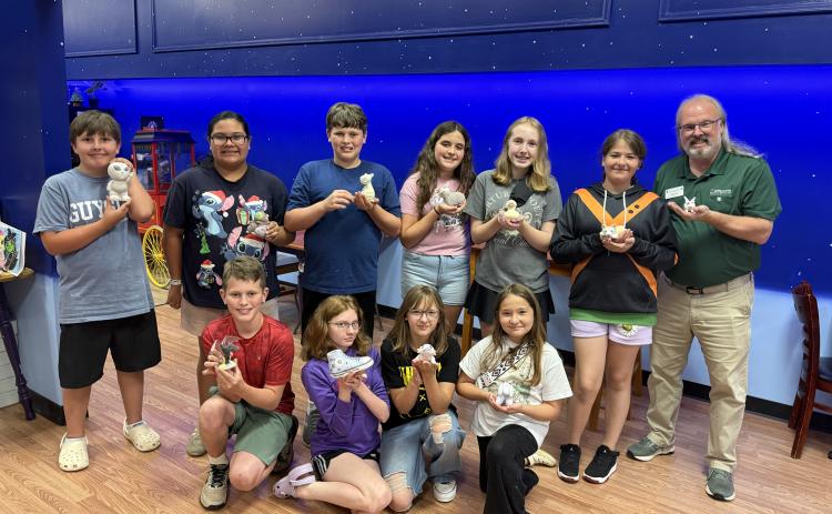Photo courtesy of Rabun County 4-H. Rabun County 4-H members explored their artistic talents during a summer outing to Celestial Studios in Gainesville on June 16. They are pictured holding their painted pottery.