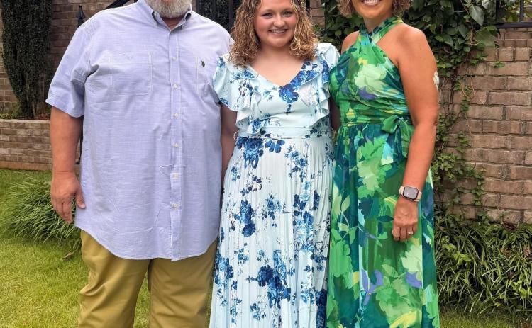 Submitted photo. Rabun County Local Amy Pruitt said her faith in God and the support of her family and friends helped her remain at peace during her journey with breast cancer. Pruitt, right, is pictured with husband Matt Pruitt and daughter Ashlynn Blackwell. 