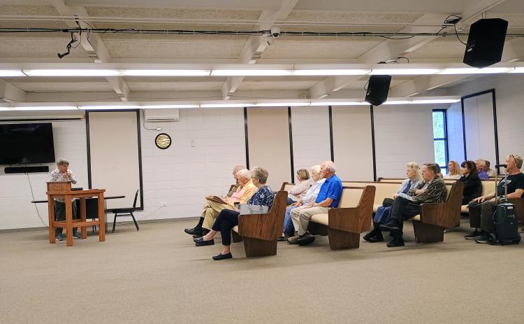 Clayton resident Dee Daley, left, speaks on Tuesday, Sept. 29, during a 10 a.m. City of Clayton budget hearing regarding a proposed tax increase. Community members attended both the 10 a.m. and 6 p.m. hearings. The third and final public hearing is scheduled for Tuesday, Oct. 13 at 4:30 p.m.