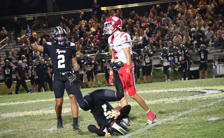 Enoch Autry/The Clayton Tribune. Rabun County’s senior receiver Reed Lafevers reacts to Commerce cornerback Makiy Sanders’ (7) interception in the final minutes of the Tigers’ 28-7 region win over the visiting Wildcats on Oct. 16. Commerce safety Jace Lyle signs the tunover to keep the Tigers undefeated.