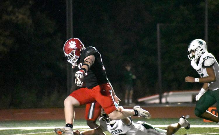 Wesley Branch/The Clayton Tribune. Rabun County senior defensive lineman Ryan Yearwood evades Athens Academy quarterback Baynes Collins for a pick-six during the second quarter of Rabun County’s 31-0 win versus Athens Academy on Oct. 9. Yearwood contributed to one of the Wildcats’ defensive touchdowns.