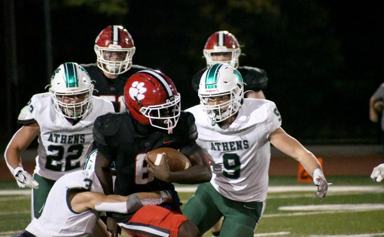 Wesley Branch/The Clayton Tribune. Rabun County senior running back and linebacker JK Fruster runs through the Athens Academy defense during the Wildcats’ Oct. 9 win versus Athens Academy. Rabun County will face Commerce on the road on Oct. 16.