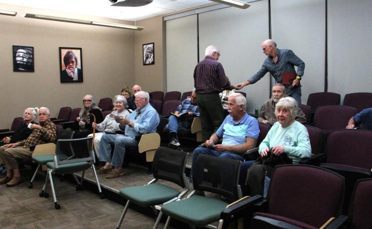 Mae Sullens/CNI News Service. Members of the Foothills Photography Group participate in a discussion on AI and photography.