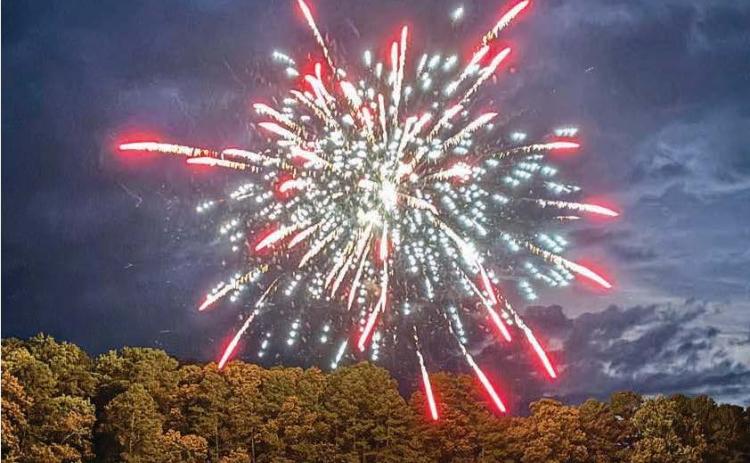 Kim Caudell/photo. Kim Caudell of Toccoa took this photo of fireworks at Bruce Creek on Lake Hartwell in Martin. Caudell won $100 for her photo, which was featured on the cover of the 2026 summer edition of Lake Living magazine.