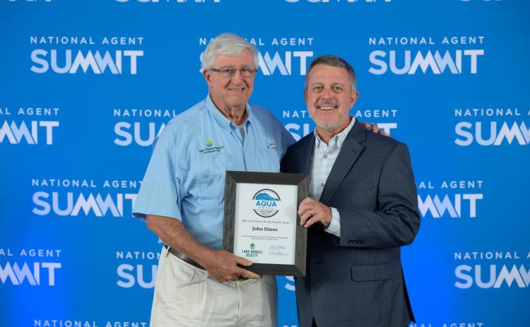 Submitted. John Dinos, left, receives high honors at National Agent Summit.