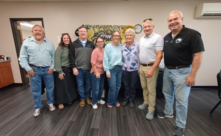Megan Horn/The Clayton Tribune. Many community members and county officials congratulated Senior Center and Transit Director Wanda Henry on her retirement after 20 years. Pictured are Rabun County Building and Grounds Director Steve Bryson, left; Rabun County Administrative Finance Clerk/Accounts Payable Amanda Crane; CFO David Conley; County Clerk Linda Ramey; Assistant Finance Officer Danielle Justice; Henry; County Administrator Darrin Giles and Commissioner Kent Woerner.