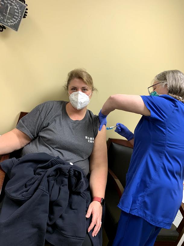 Photo courtesy Rabun County EMS. Stephanie Quilliams receives a COVID-19 vaccine administered by Josie Mosley at the Rabun County Health Department recently.