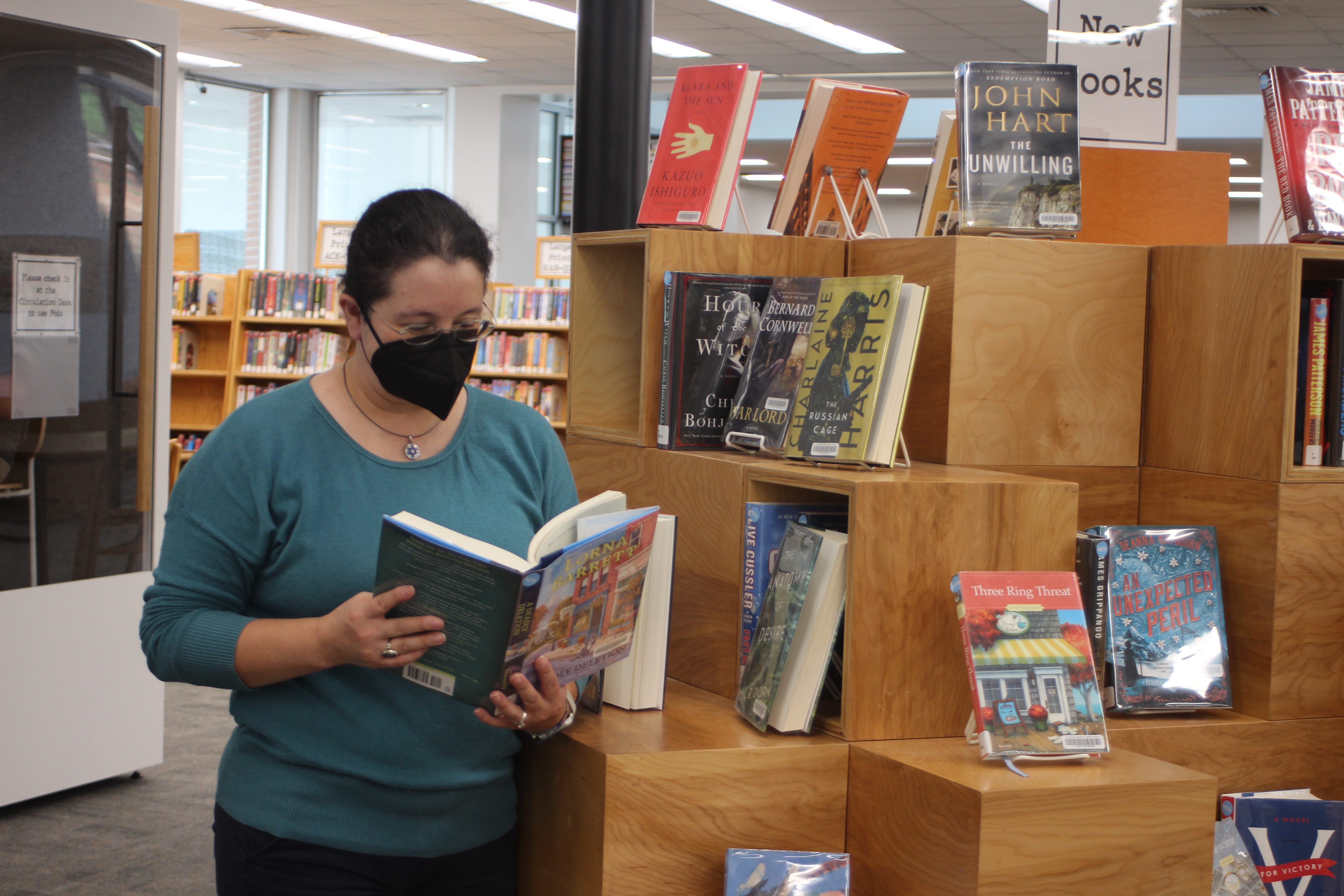 Megan Broome/The Clayton Tribune. The Rabun County Public Library is highly recommending patrons wear masks in the facility. Dyana Costello Banks, library manager, dons a mask.