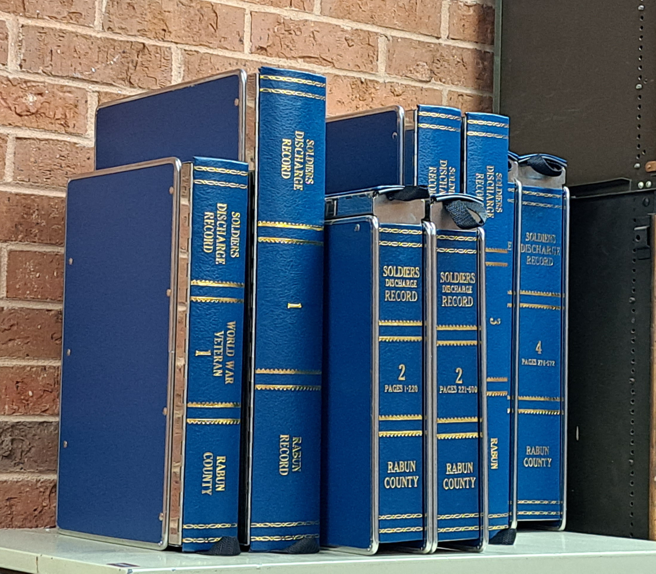 Megan Broome/The Clayton Tribune. Volumes of Military Discharge Records, also known as DD214’s, have been preserved at the Rabun County Superior Clerk of Court Office. The military discharge records are now housed in Kofile Disaster Safe County Binder (DSB). Veterans are encouraged to file their military discharge papers, free of charge, at the office. 