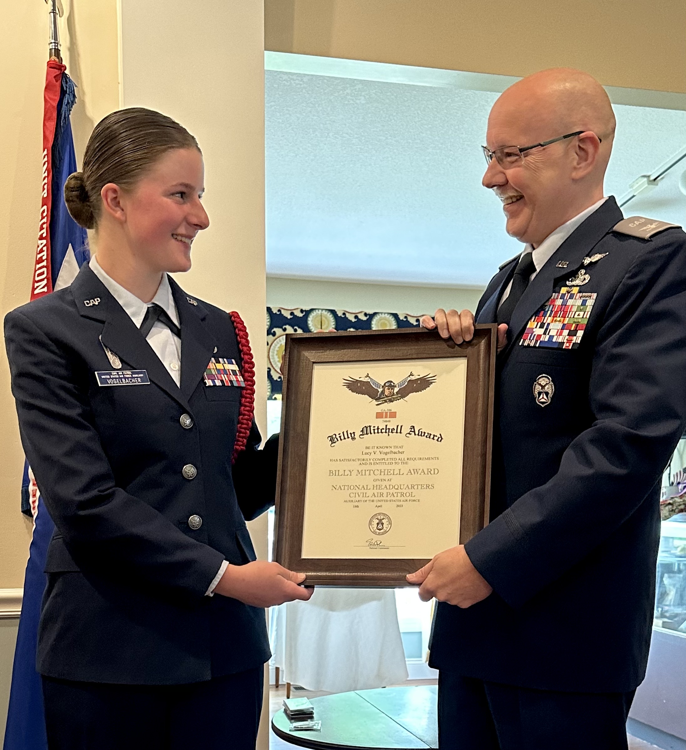 Submitted photo. Cadet Second Lieutenant Lucy Vogelbacher is presented with the Billy Mitchell Award from Colonel Jeffrey Garrett, CAP Georgia Wing Commander on May 21. 