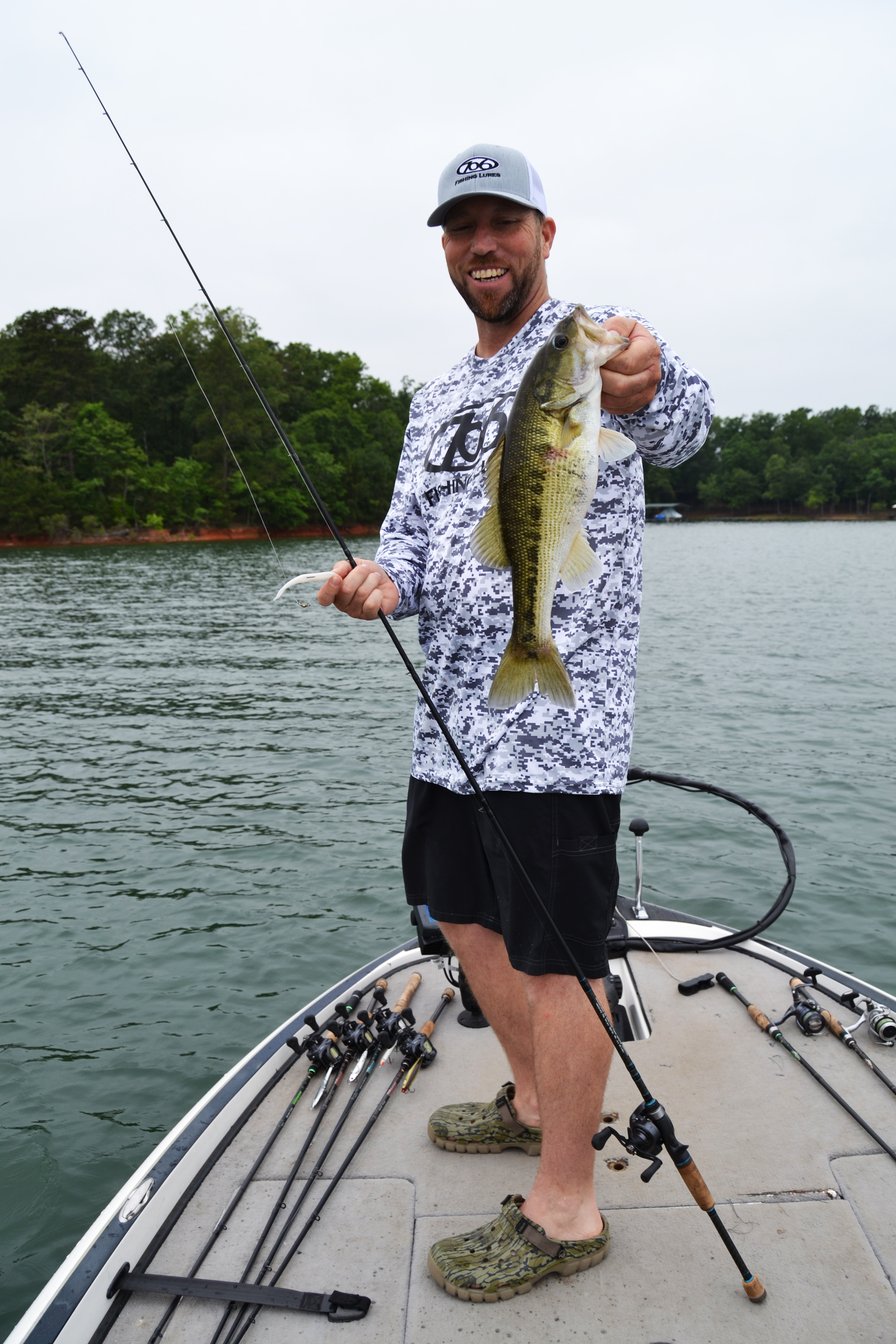 Fishing guide Josh Fowler shows a large mouth bass caught on Lake Hartwell. (Photo/Michael Isom)