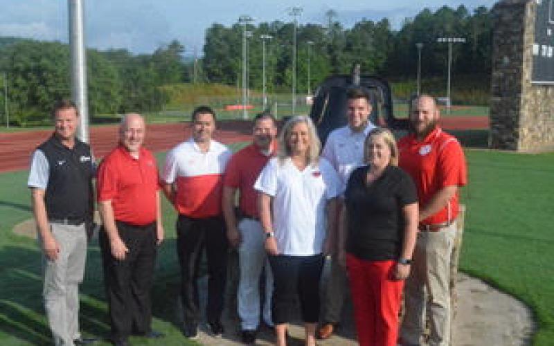 Wayne Knuckles/The Clayton Tribune. Allen Blair, back left, assistant principal of Rabun County High School (RCHS), Dr. Jay Fowler, principal of Rabun County Primary School (RCPS), Jonathan Gibson, assistant superintendent, Marty Dixon, transportation director, Justin Spillers, principal of RCHS, and John Franco, assistant principal of Rabun County High School. (front) Dr. April Childers, superintendent, and Kelly McKay, assistant superintendent.