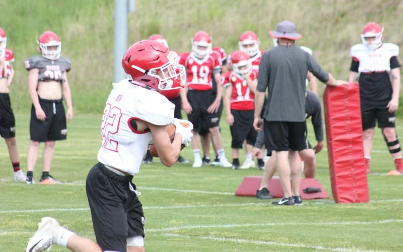 Rabun County cornerback Hunter Moore (22) catches a pass during a drill at a practice in Tiger in May. (Photo By Glendon Poe/The Clayton Tribune)