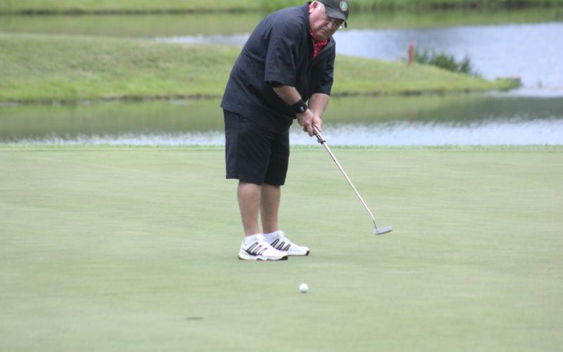 Larry Gillespie putts on No. 18 during the Sid Weber Memorial Cancer Fund golf tournament at Sky Valley Country Club last Wednesday. (Photo by Glendon Poe/The Clayton Tribune)