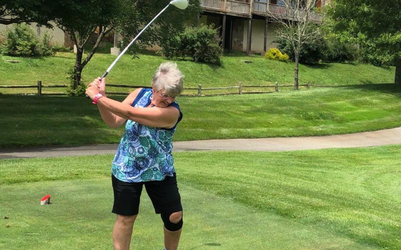Vickie Heher tees off during the Sid Weber Memorial Cancer Fund golf tournament at Sky Valley Country Club last  Wednesday. (Photo by Jennifer Arbitter/Special to The Tribune)