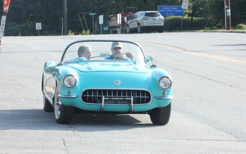 Beanie Ramey, left, and Tom Major ride in the ceremonial car at the start of Rabun County’s Bicentennial Torch and Flag Fun Run in Clayton on Saturday morning. (Glendon Poe/The Clayton Tribune)