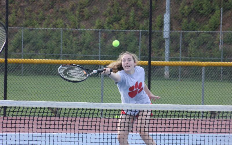 Anna Raye Darnell returns a shot during a drill at Rabun County’s Wildcat Tennis Academy at Rabun County High School’s tennis courts in Tiger on Monday night. (Glendon Poe/The Clayton Tribune)