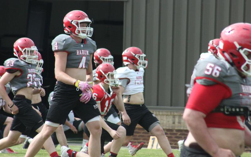 Rabun County wide receiver Braxton Hicks smiles during the team’s warm-up session at a spring practice in May. (Glendon Poe/The Clayton Tribune)