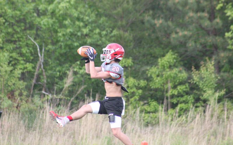 Rabun County wide receiver Sutton Jones catches a pass during a team workout in May. (Glendon Poe/The Clayton Tribune)