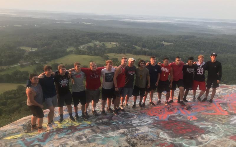 Rabun County senior football players are pictured with coach Jaybo Shaw at Currahee Mountain. (Submitted Photo)