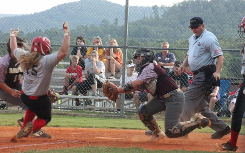 Rabun County’s Courtney Stewart, left, slides for home plate during a game against Dawson at Rabun County High School in Tiger last Thursday. (Glendon Poe/The Clayton Tribune)