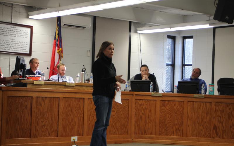 Megan Broome/The Clayton Tribune. Kathy Lee addresses Clayton City Council members at their meeting Tuesday to discuss meter cost concerns on a property she owns in Mountain City where she plans to have a community of tiny homes. 