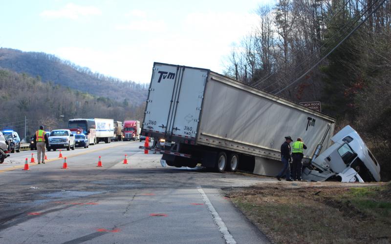 Megan Broome/The Clayton Tribune. A wreck involving a tractor trailer and two vehicles in Mountain City on Saturday afternoon resulted in injuries. 