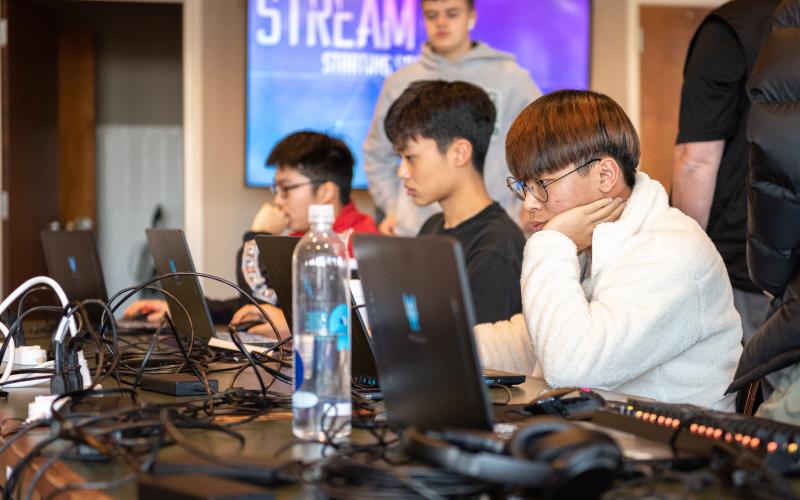 E. Lane Gresham/Tallulah Falls School. Shown in the foreground is Tallulah Falls School junior Justin Yu of South Korea during the Jan. 21 Esports Elite Eight match versus Lambert High School. Also shown, front to back, are team members Daniel Shin of South Korea and Janson Zhou of the People's Republic of China, both freshman.