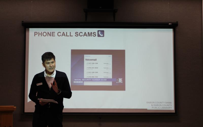 Yong Kim, executive vice president and CFO of Rabun County Bank, speaks to a group at a lunch and learn sponsored by Rabun County Bank about how to spot fraud and prevent being scammed on Tuesday, Jan. 28 at the Rabun County Library. 