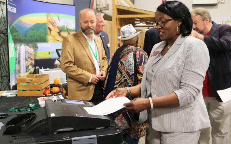 Rep. Patty Bentley tests out a new voting machine during a demonstration at the Georgia State Fair. (Secretary of State’s office)