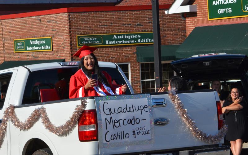 Wayne Knuckles/The Clayton Tribune. Members of the Class of 2020 were honored with a parade through Clayton Tuesday. Guadalupe Mercado-Castillo is all smiles as the crowd applauds. 