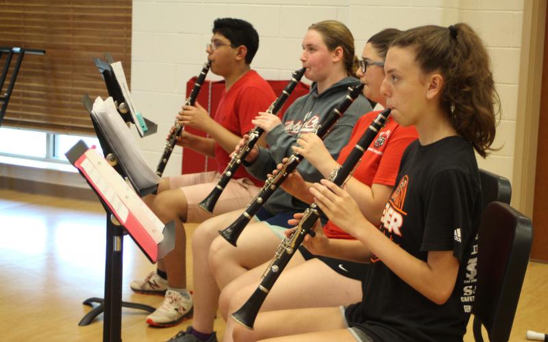 Ethan Avendano, left, Sarah Abernathy, Charlotte Hughes and Katie Shields practice during woodwind sectionals in the Rabun County High School band room at band camp.