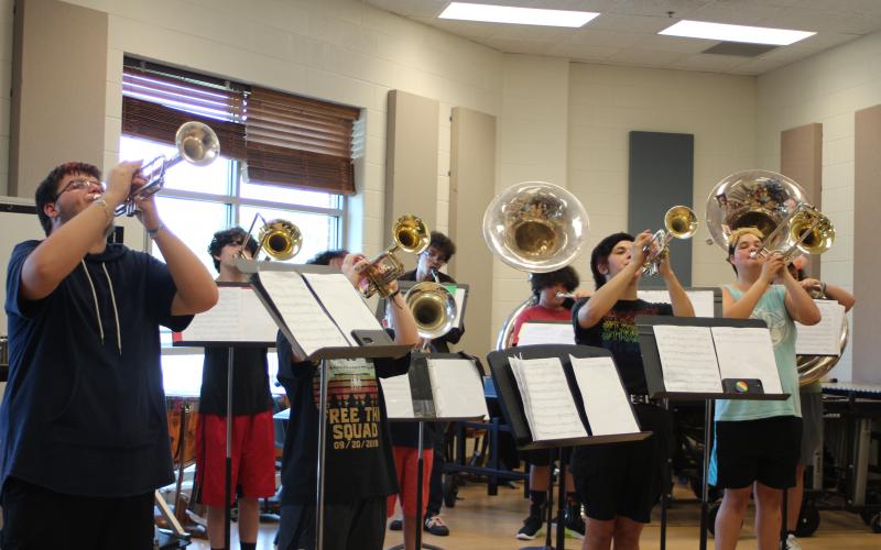 Zain Harding, left, Trey Mize, Randall Ramey and Jalyn Fisher practice during brass sectionals in the Rabun County High School band room at band camp. 