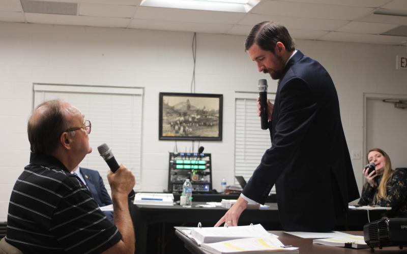 Megan Broome/The Clayton Tribune. David Irvin, left, is questioned by Tallulah Falls Town Attorney Warren Tillery at a hearing earlier this month to determine if J&D Irvin Holdings has a vested right to operate their short-term vacation rental business after a zoning map change. 