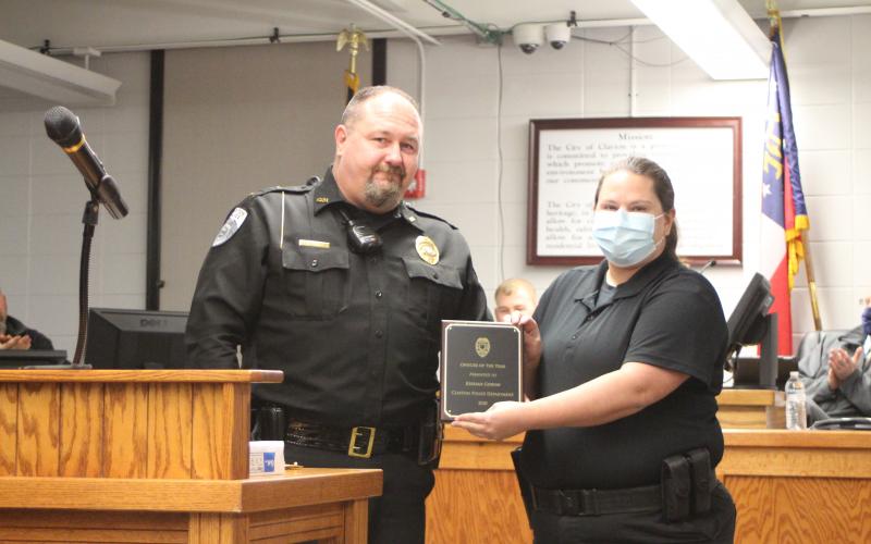 Megan Broome/The Clayton Tribune. Clayton Police Chief Andy Strait presents the Officer of the Year award to Kessiah Gipson. 