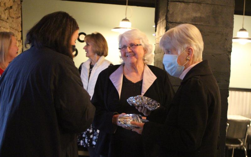 Megan Broome/The Clayton Tribune. Melody Henderson, Chamber of Commerce board secretary, left, Juanita Shope and Gwen Fink converse at a reception last Thursday to honor Shope’s service to Rabun County as she steps down as president and community liaison of the Rabun County Chamber of Commerce. The event was held at The Diner below the Rabun County Civic Center. 