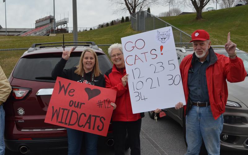 Wayne Knuckles/The Clayton Tribune. Kelly McKay, Carolyn and Winfred McKay show their support for the Wildcats. 
