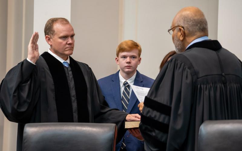 Photo from Court of Appeals SmugMug. Judge Brian M. Rickman is sworn in as Chief Judge of the Court of Appeals of Georgia by Judge Herbert E. Phipps, who is also on the Court of Appeals. The ceremony took place on June 24 in the courtroom of the Nathan Deal Judicial Building.