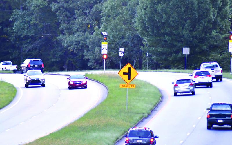 Enoch Autry/The Clayton Tribune. Traffic travels in both directions on Highway 441 through the Tallulah Falls school zone Tuesday morning. Electronic devices in operation during school hours has increased speeding tickets into the thousands.