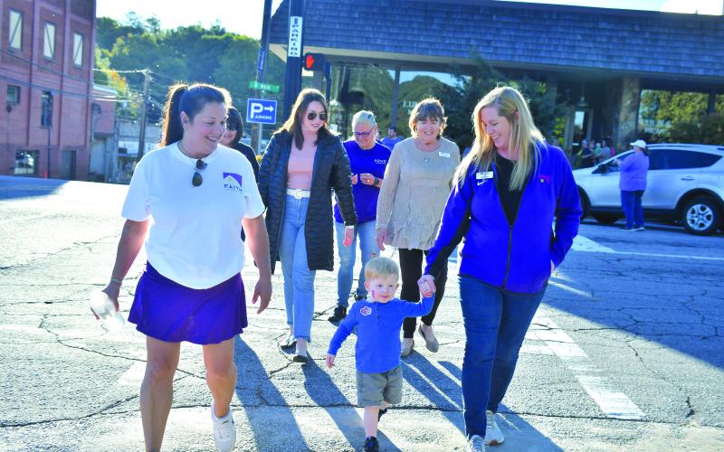 Megan Broome/The Clayton Tribune. Laura Davis, Finnley Smith, Jekka Smith, Jenifer Kulow, Susan Kulow and Dena Crane participate in the Hope Walk in solidarity with those who have been affected by domestic violence to bring awareness to October as “Domestic Violence Awareness Month.”