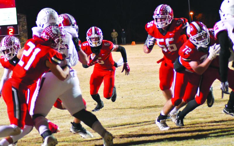 Enoch Autry/The Clayton Tribune. Rabun County senior wide receiver Jaden Gibson takes a direct snap for a two-yard rushing touchdown.  Gibson also added two receiving touchdowns on 10 catches for 201 yards. After winning 42-0 against Social Circle, RCHS will travel to take on Swainsboro on Friday, Nov. 25. The kickoff for the quarterfinal matchup between two ranked teams will be at 7 p.m.