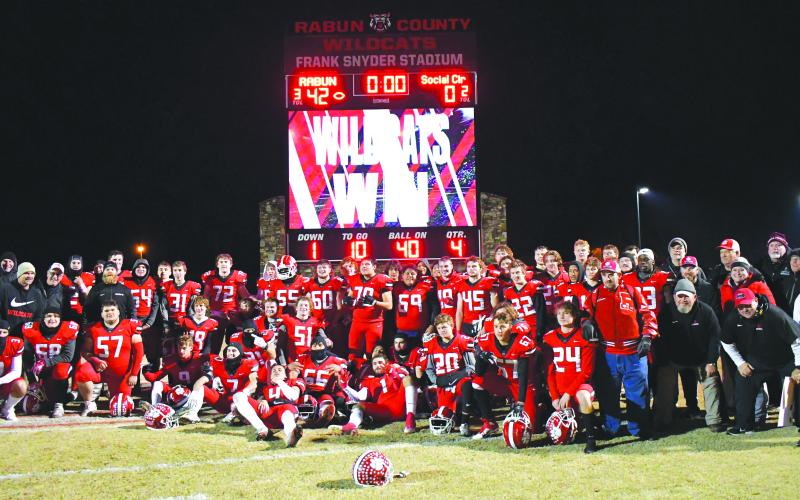 Enoch Autry/The Clayton Tribune. The Rabun County High School football team and coaches pose after another second round victory. The Wildcats have won eight straight second round games and now travel to take on Swainsboro on Friday, Nov. 25