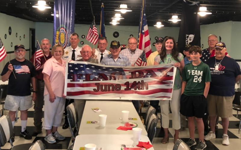 Photo courtesy of the Forward Rabun/ Rabun County Chamber of Commerce. Veterans at the Vet to Vet Café gather and celebrate Flag Day. The Vet to Vet Café provides local veterans and their families an opportunity to socialize as well as give them the opportunity to access current information relevant to veterans benefits and services.